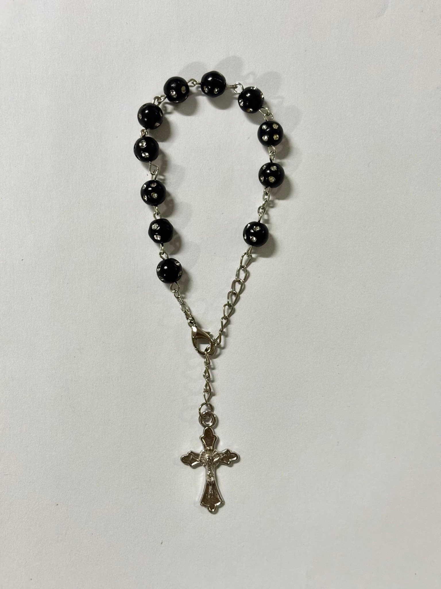 Black bead rosary bracelet with silver-tone crucifix