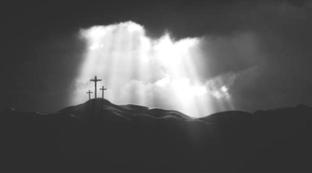 Crosses on Calvary beneath rays of light