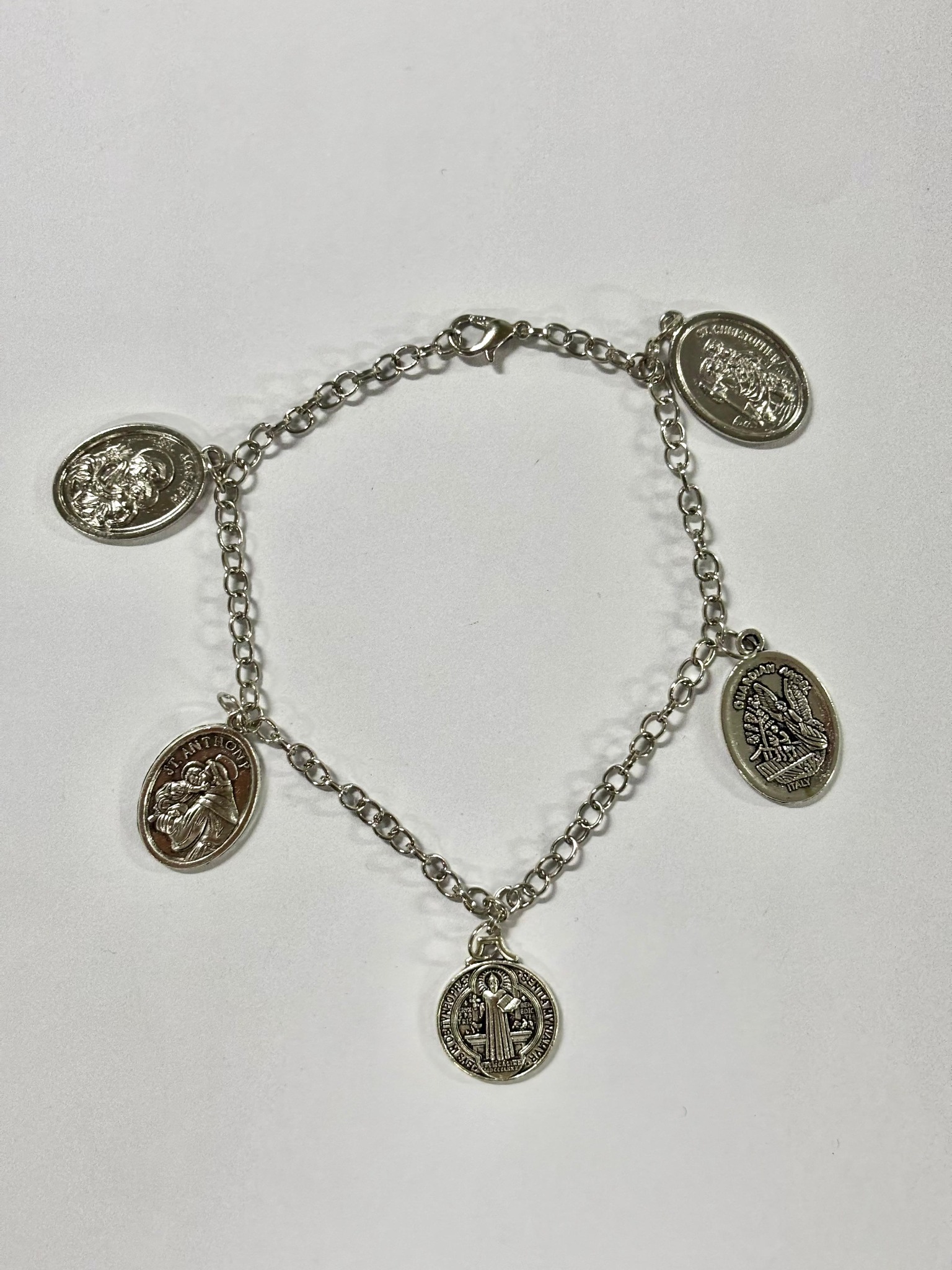 Silver-tone Catholic charm bracelet with five devotional medals
