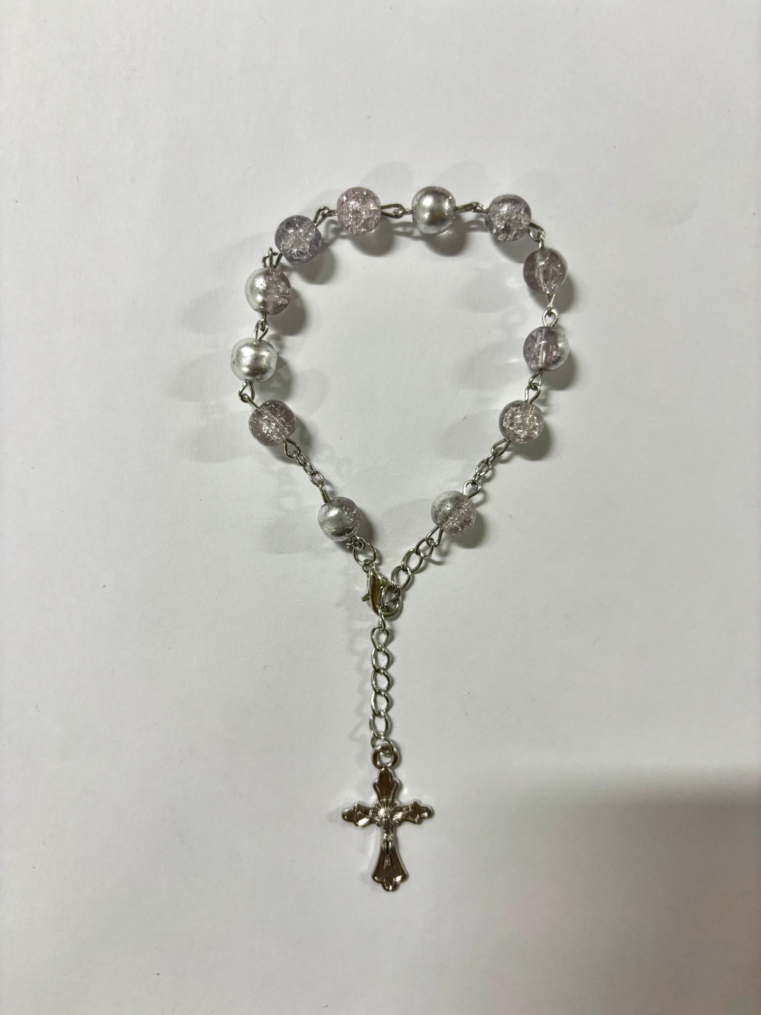 Clear and silver bead rosary bracelet with silver-tone crucifix