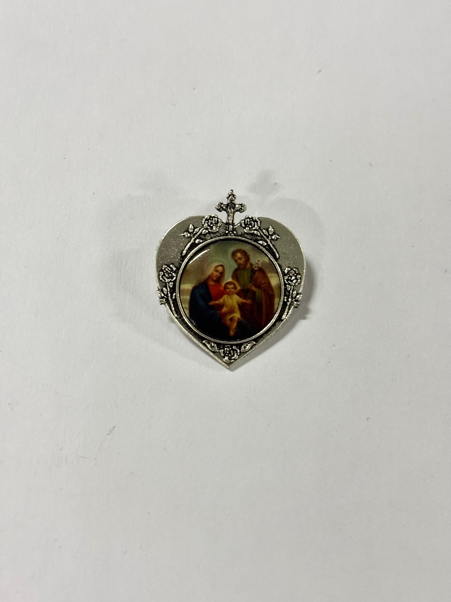 Silver-tone heart brooch featuring the Holy Family