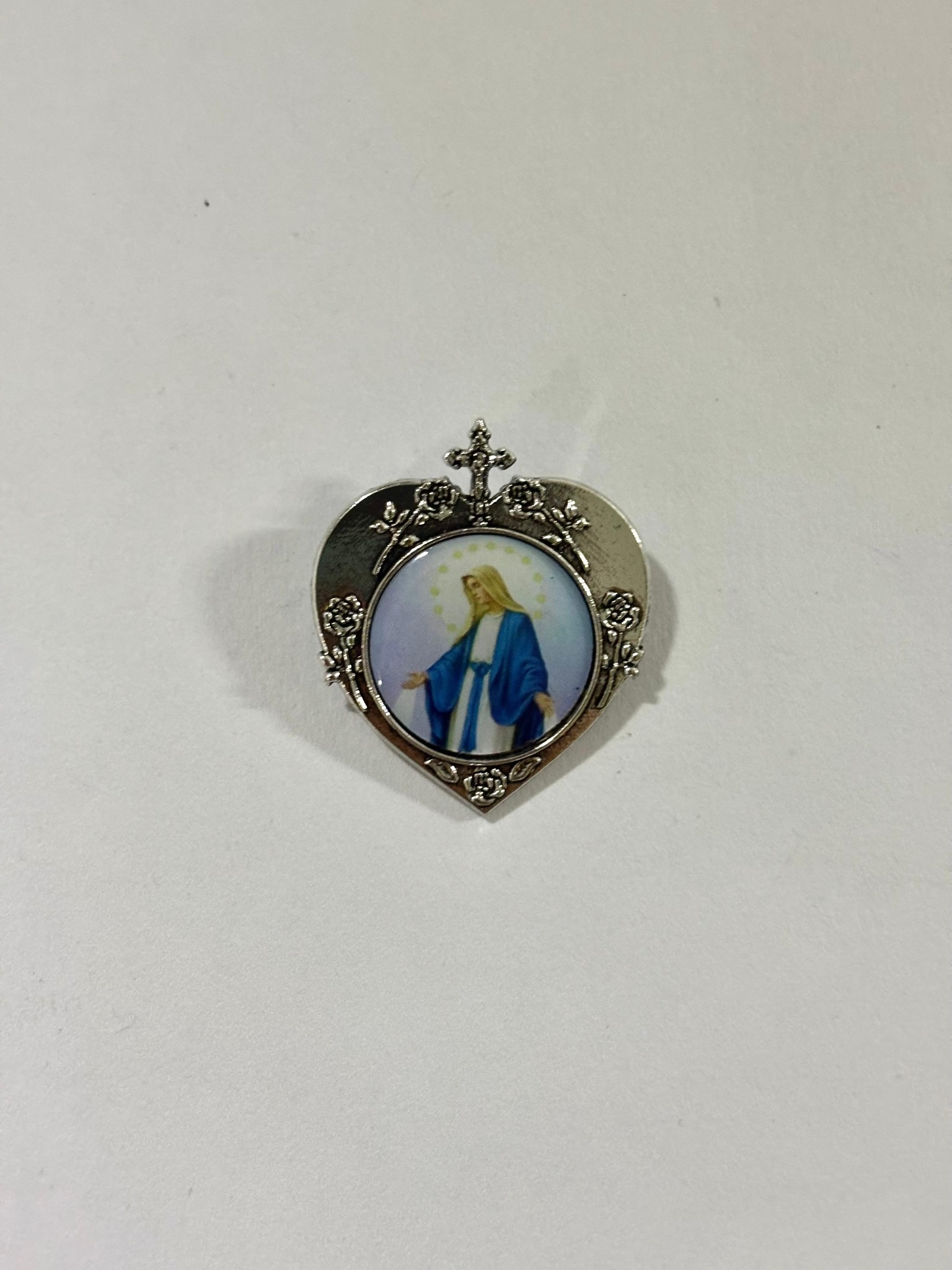 Silver-tone heart brooch featuring the Miraculous Medal image