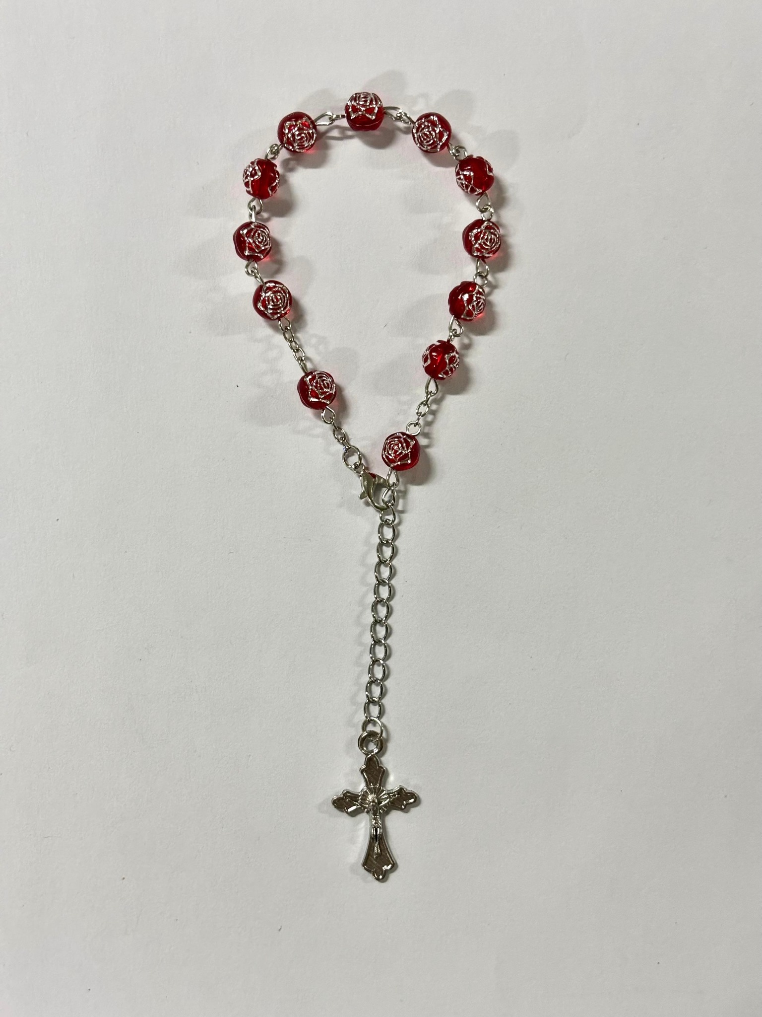 Red rose bead rosary bracelet with silver-tone crucifix
