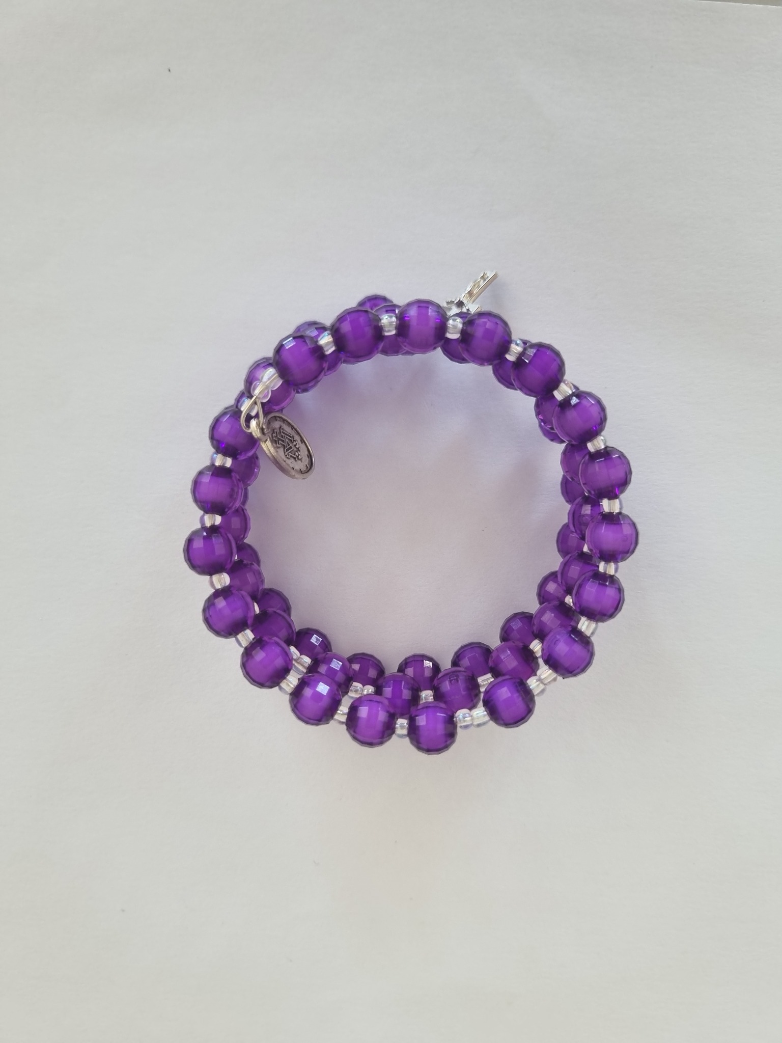 Purple Catholic rosary bracelet with devotional medal and crucifix charm