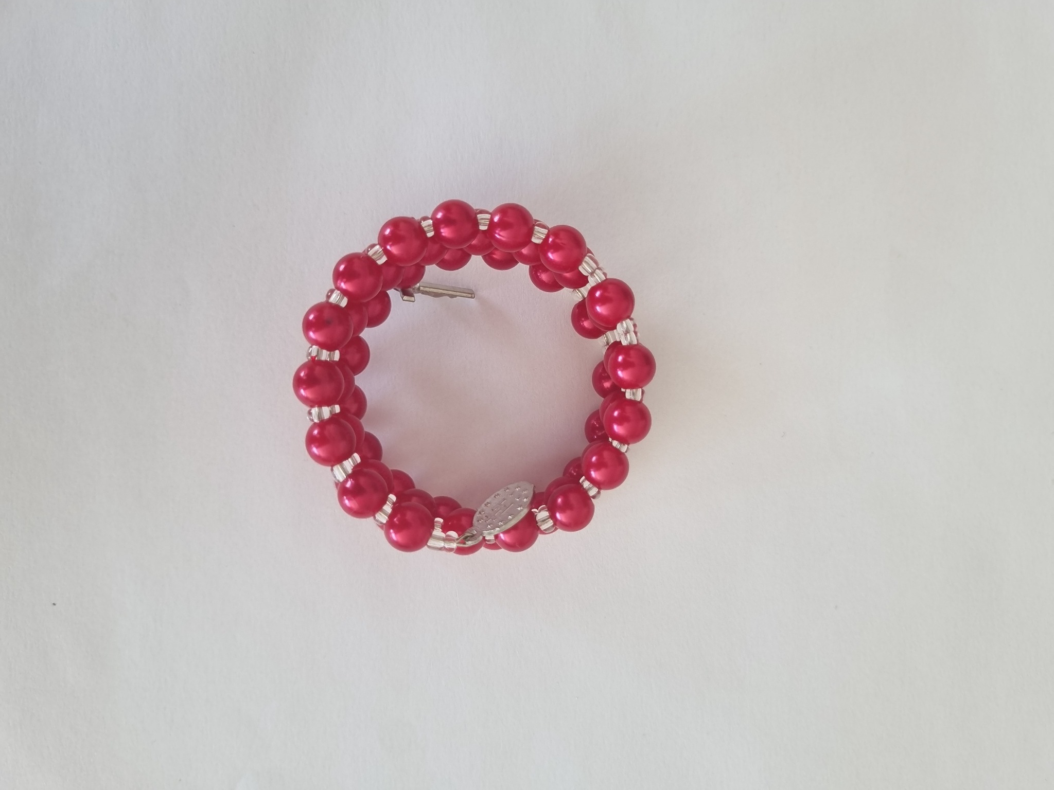Red Catholic rosary bracelet with devotional medal and crucifix charm