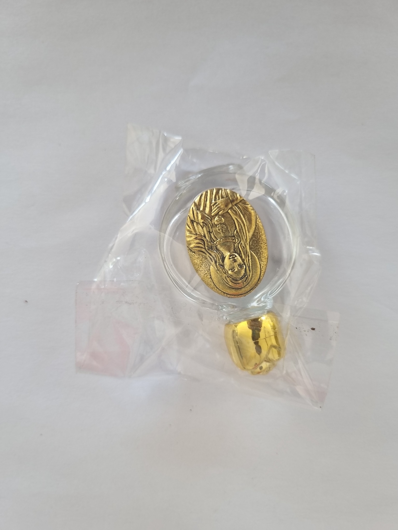 Gold-tone round glass holy water bottle