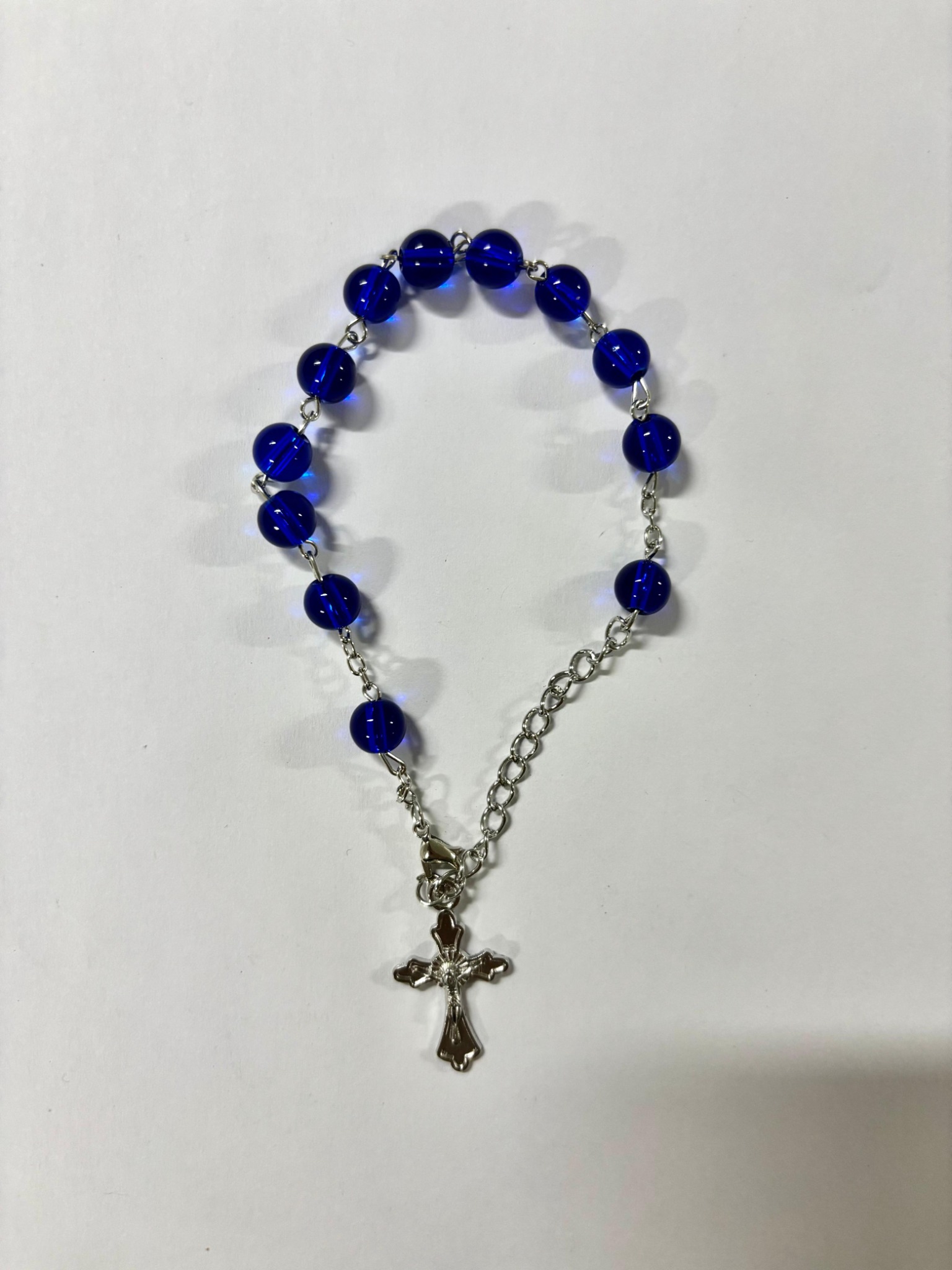 Royal blue bead rosary bracelet with silver-tone crucifix