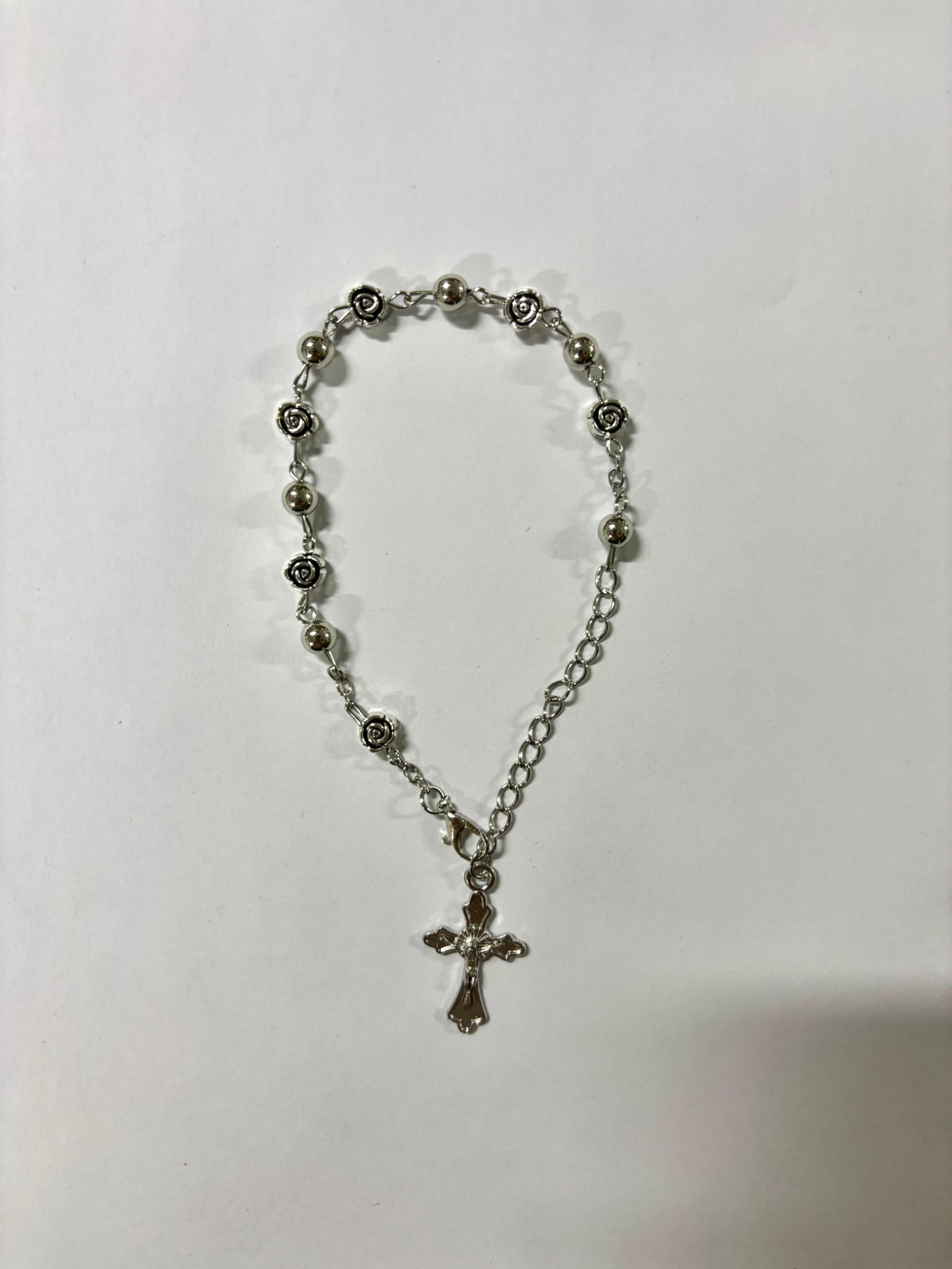Silver rose rosary bracelet with silver-tone crucifix
