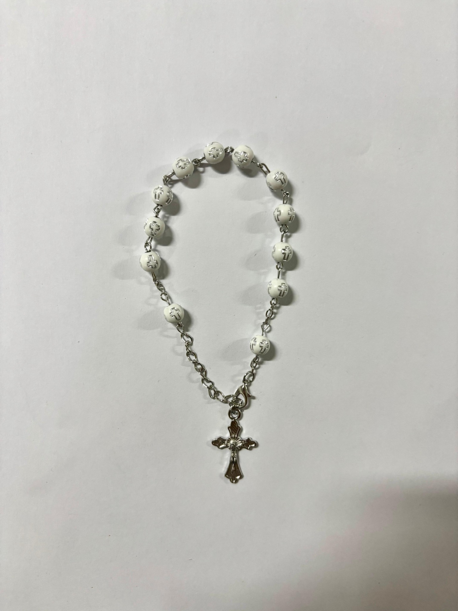 White cross-detail bead rosary bracelet with silver-tone crucifix