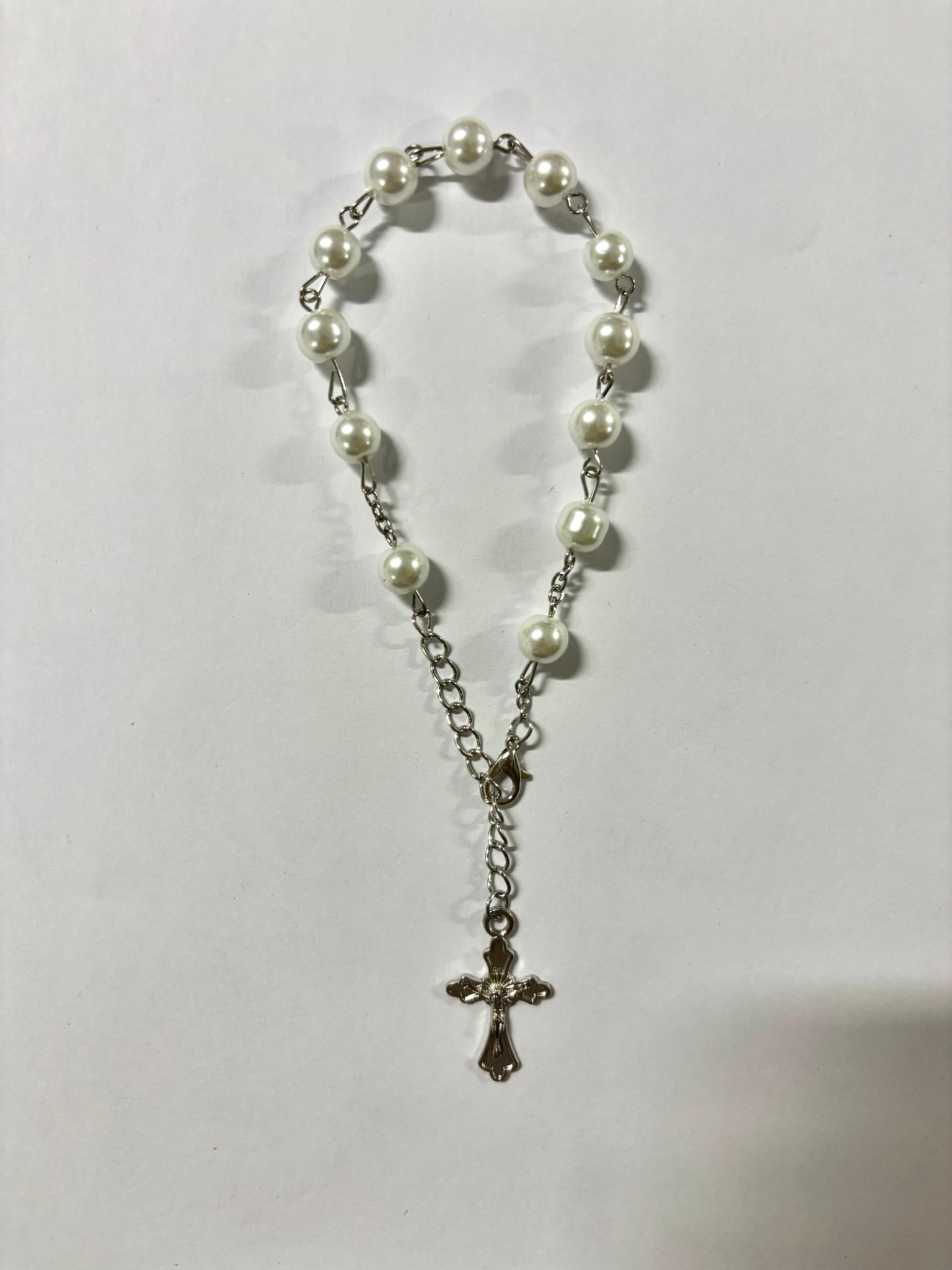 White pearl bead rosary bracelet with silver-tone crucifix