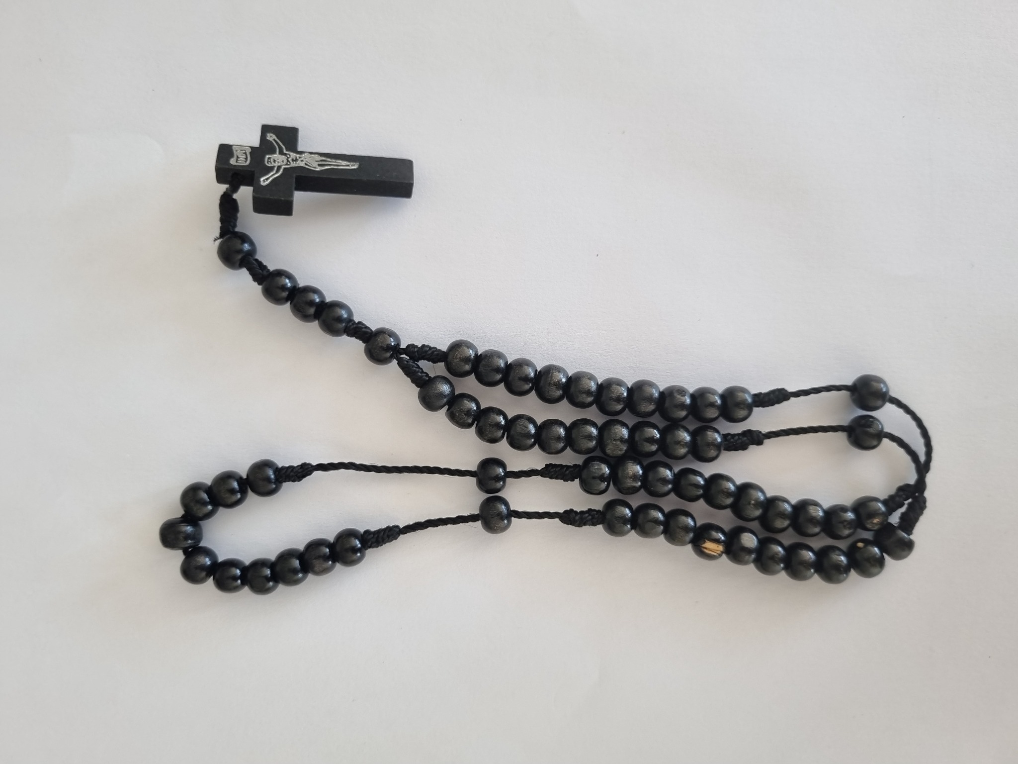 Black wooden Catholic rosary with black crucifix